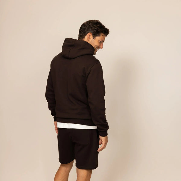 Man wearing a cotton fleece hoodie in Smoked Brown, rear view.|smoked brown