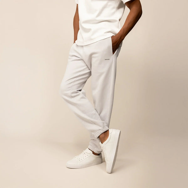 Man wearing Marame Cotton Fleece Joggers in Ash White, front view.|ash white