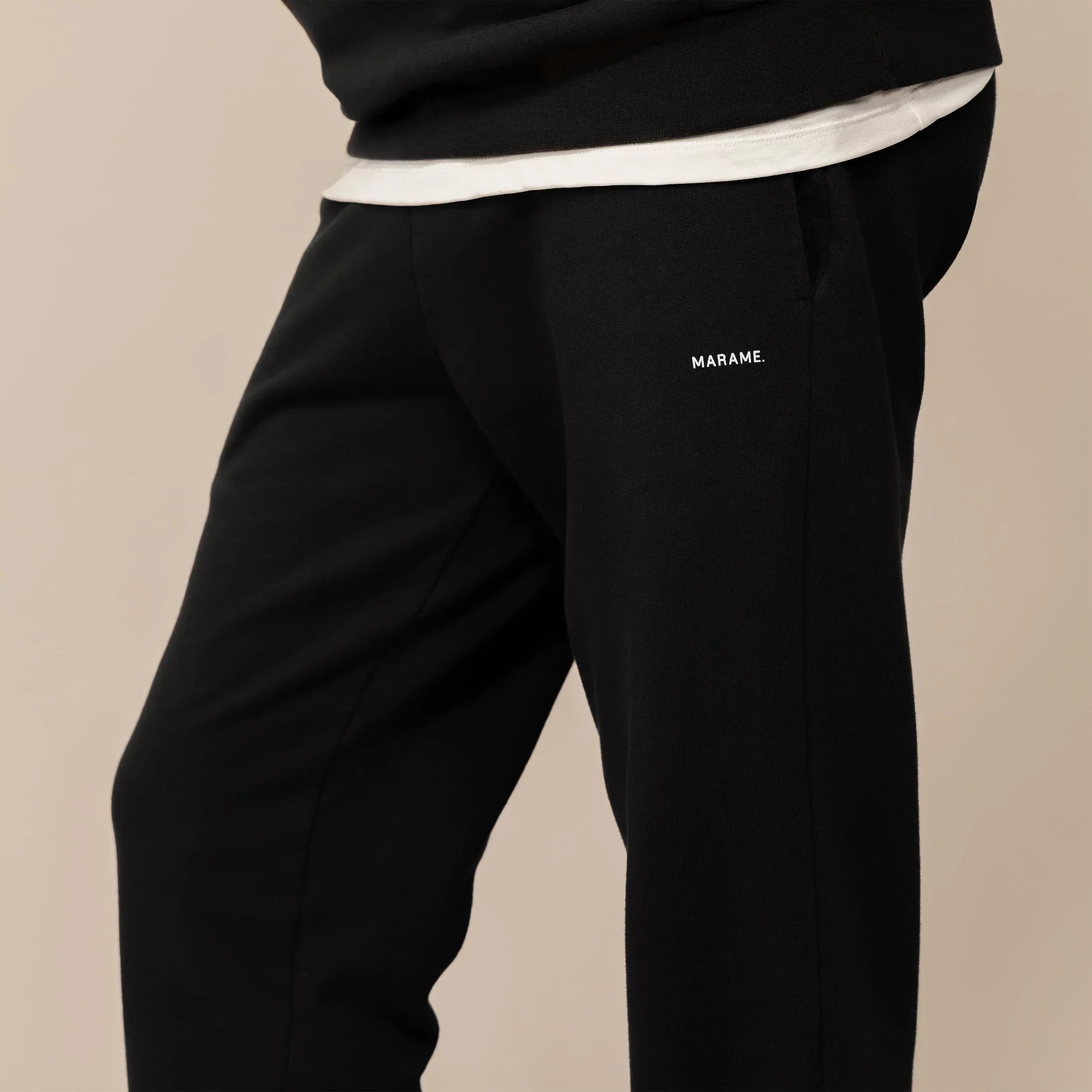 Man wearing Cotton Fleece Joggers in Black, front view.|black