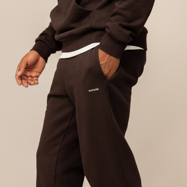Man wearing Cotton Fleece Joggers in Smoked Brown, front view.