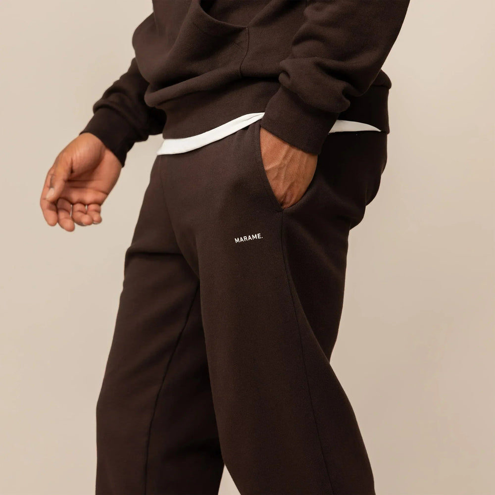 Man wearing Cotton Fleece Joggers in Smoked Brown, front view.|smoked brown