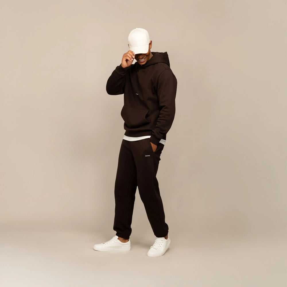 Man wearing Marame Cotton Fleece Joggers in Smoked Brown, full view.|smoked brown