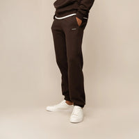 Man wearing Marame Cotton Fleece Joggers in Smoked Brown, front view.
