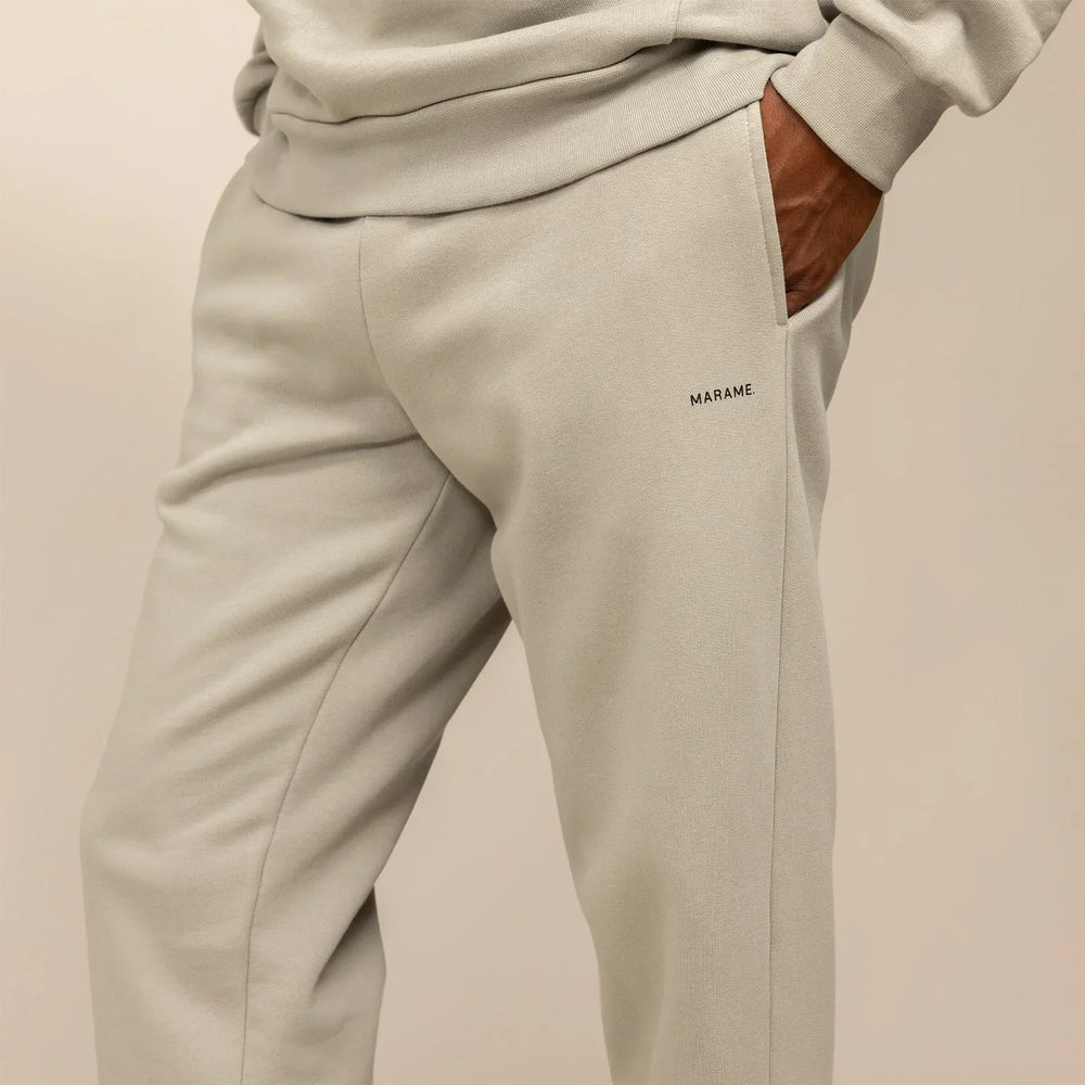 Man wearing Cotton Fleece Joggers in Wolf Grey, closeup.|wolf green