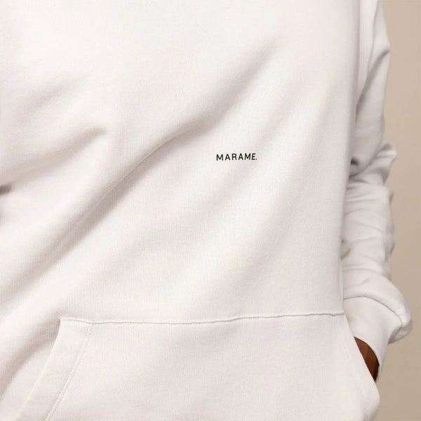 Man wearing a cotton fleece Logo Hoodie in Ash White, closeup.|ash white