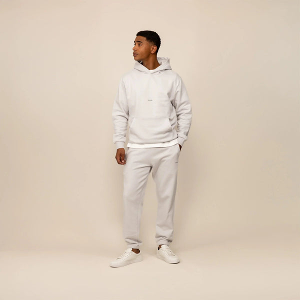 Man wearing a Marame cotton fleece Logo Hoodie in Ash White, full view.|ash white