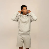Man wearing a Marame cotton fleece Logo Hoodie in Wolf Grey, front view.|Wolf Green