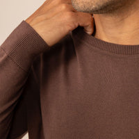 Man wearing a Fine Knit Crew Neck Jumper in Conker Brown, closeup.
