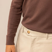 Man wearing a Marame Fine Knit Crew Neck Jumper in Conker Brown, closeup.
