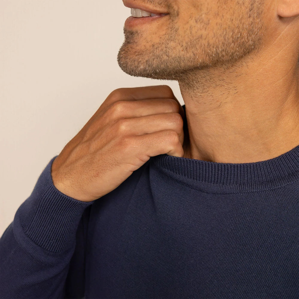 Man wearing a Fine Knit Crew Neck Jumper in Navy, closeup.