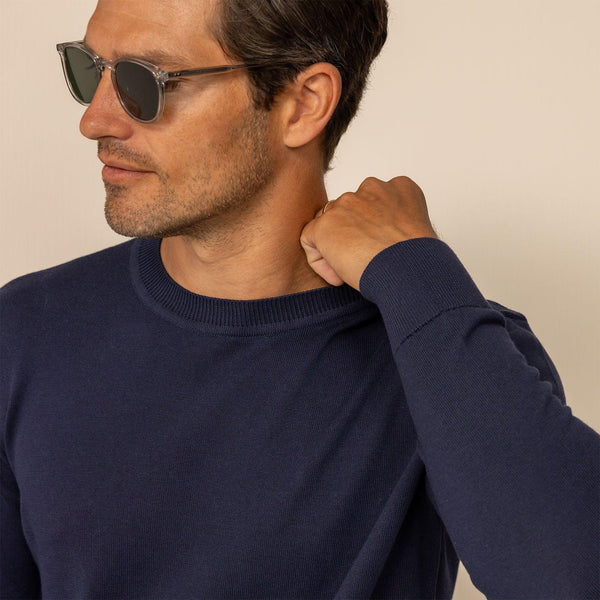 Man wearing a Marame Fine Knit Crew Neck Jumper in Navy, front view.