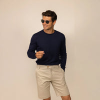 Man wearing a Marame Fine Knit Crew Neck Jumper in Navy, front view.