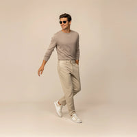 Man wearing a Marame Fine Knit Crew Neck Jumper in Putty Dove, front view.
