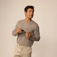 Man wearing a Marame Fine Knit Crew Neck Jumper in Putty Dove, front view.