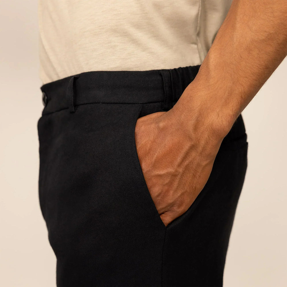 Man wearing Casual Linen Blend Trousers in Black, closeup.
