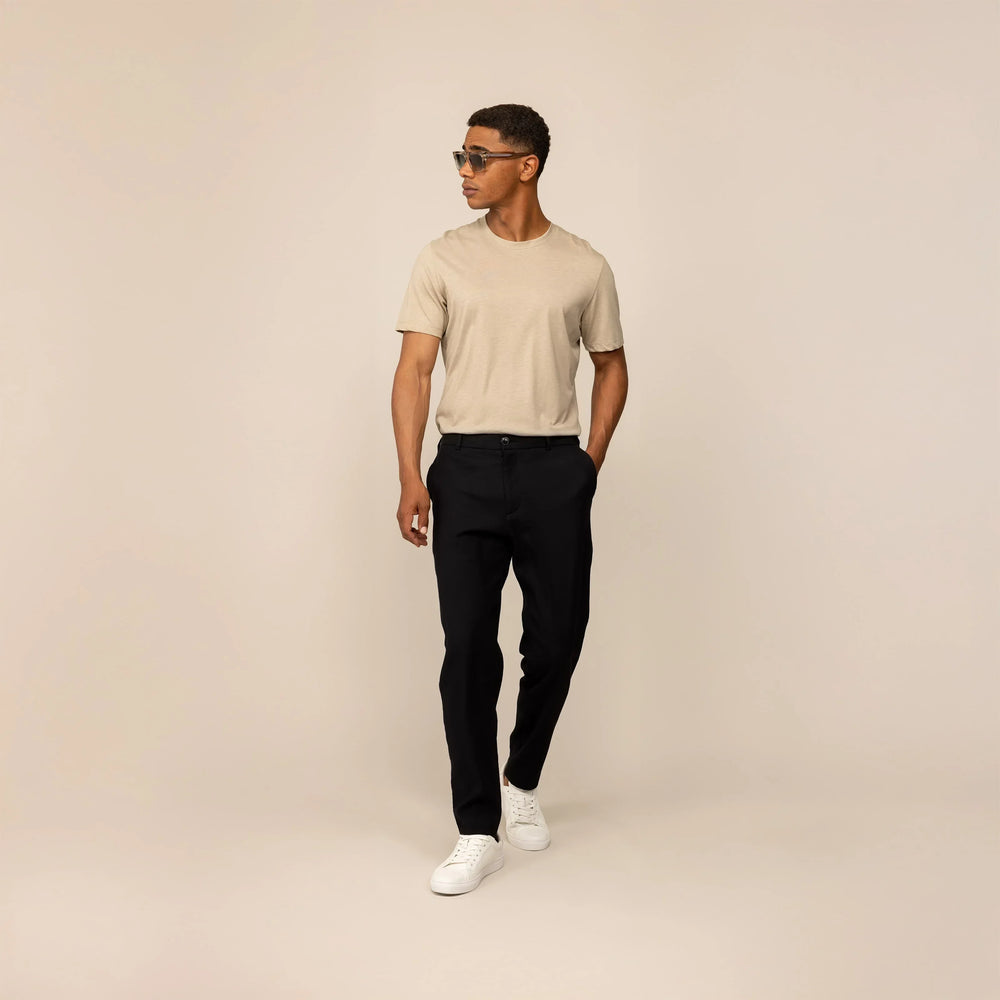 Man wearing Marame Casual Linen Blend Trousers in Black, front view.