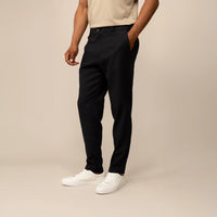 Man wearing Marame Casual Linen Blend Trousers in Black, front view.