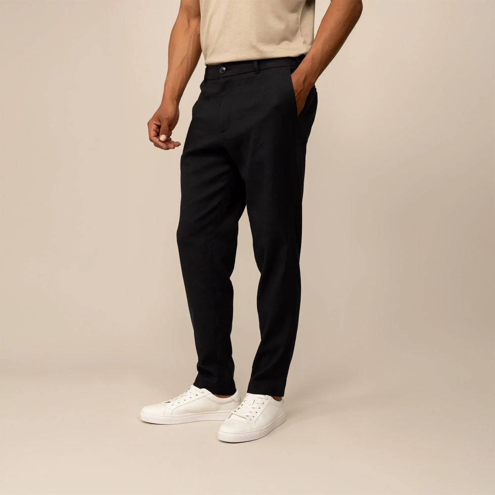 Man wearing Marame Casual Linen Blend Trousers in Black, front view. |black 
