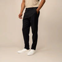 Man wearing Marame Casual Linen Blend Trousers in Black, front view. |black 