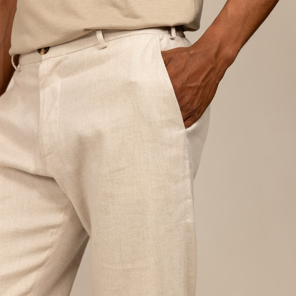 Man wearing Marame Casual Linen Blend Trousers in Woven Sand, closeup.