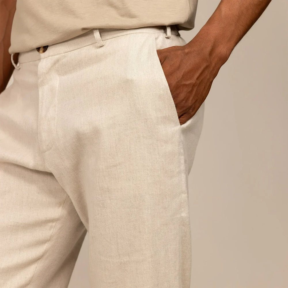 Man wearing Marame Casual Linen Blend Trousers in Woven Sand, closeup.