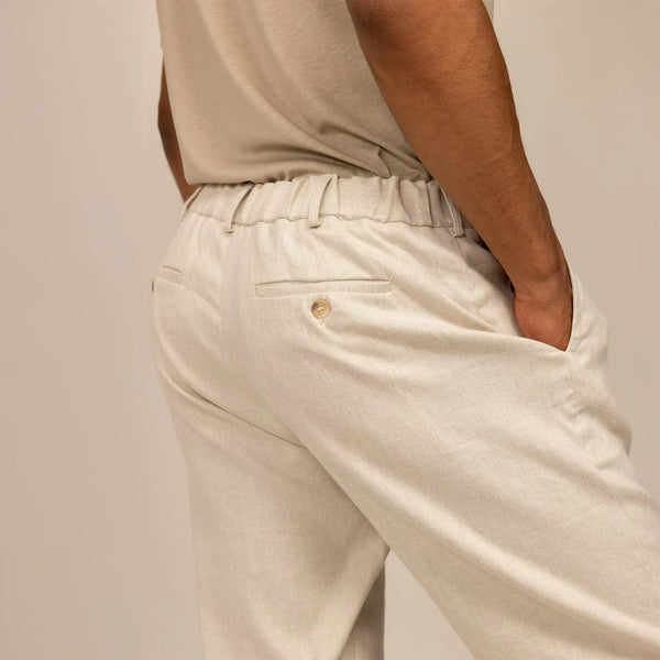 Man wearing Casual Linen Blend Trousers in Woven Sand, rear view. |woven sand