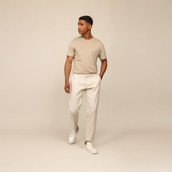 Man wearing Marame Casual Linen Blend Trousers in Woven Sand, front view.