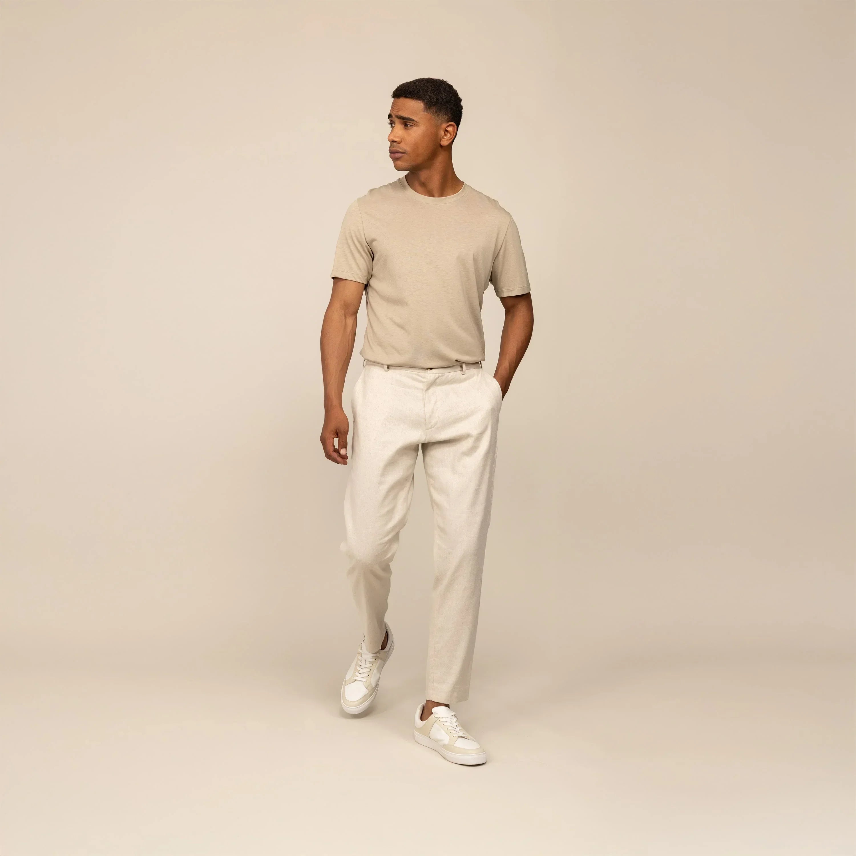 Man wearing Marame Casual Linen Blend Trousers in Woven Sand, front view. |woven sand
