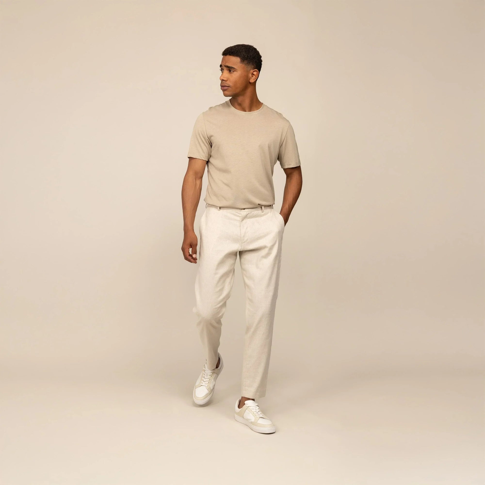 Man wearing Marame Casual Linen Blend Trousers in Woven Sand, front view. |woven sand