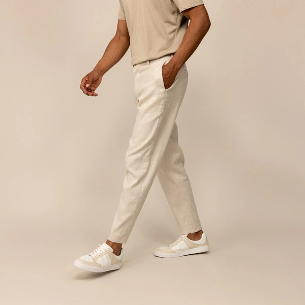 Man wearing Marame Casual Linen Blend Trousers in Wovern Sand, front view. |woven sand
