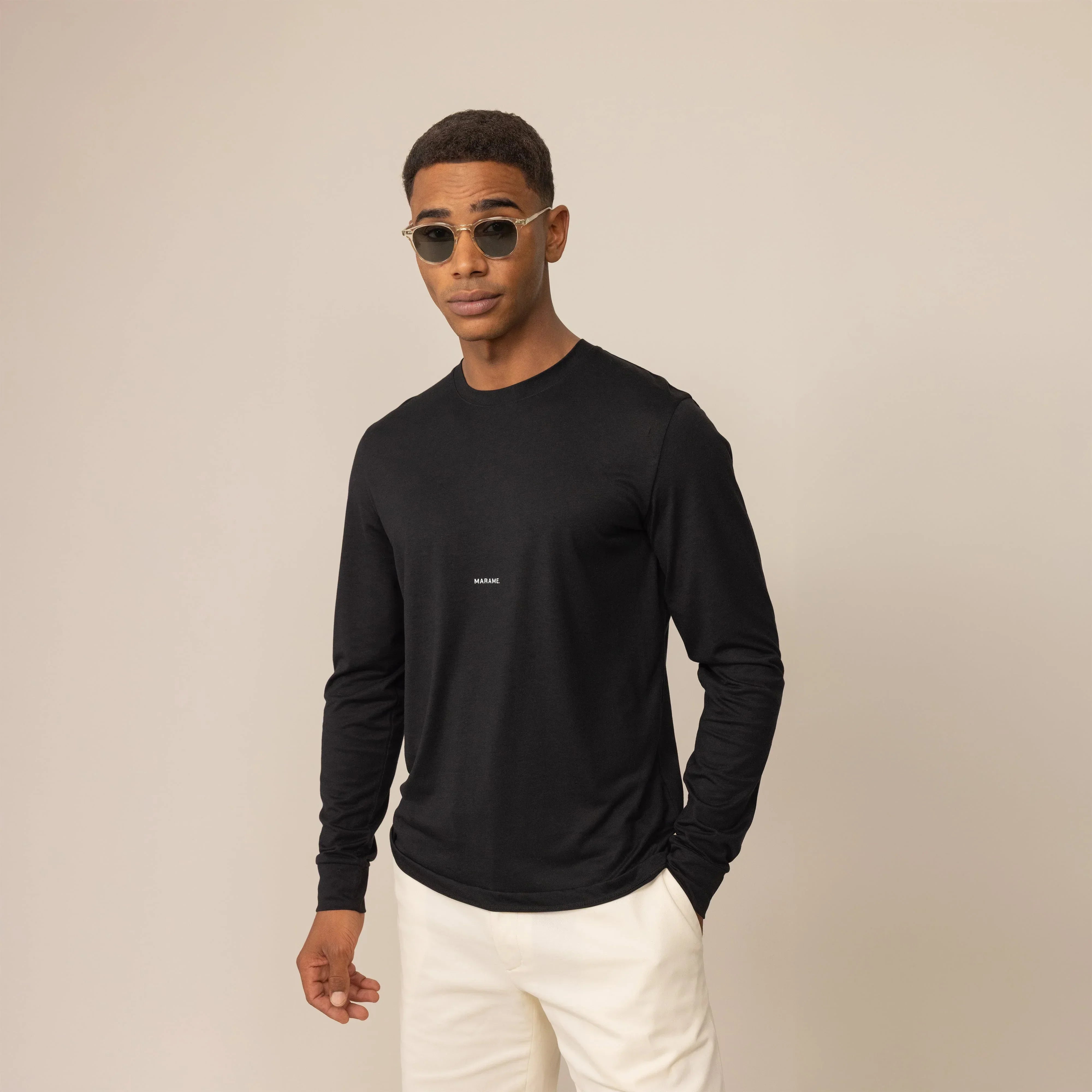 Man wearing a Long Sleeve Logo T-Shirt in Black, front view. |black