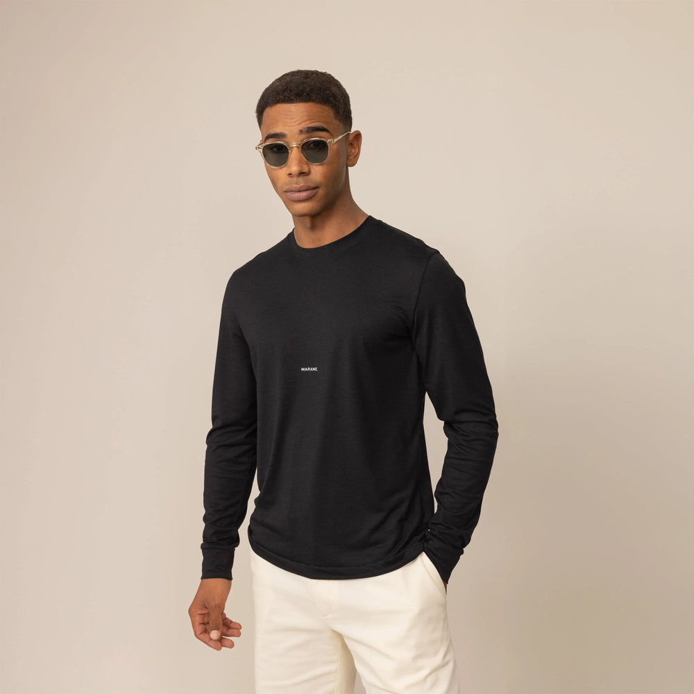 Man wearing a Long Sleeve Logo T-Shirt in Black, front view. |black