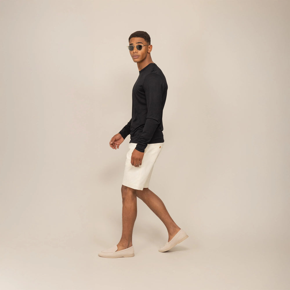 Man wearing a Marame Long Sleeve Logo T-Shirt in Black, front view.