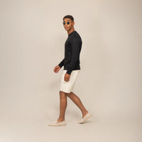 Man wearing a Marame Long Sleeve Logo T-Shirt in Black, front view. |black