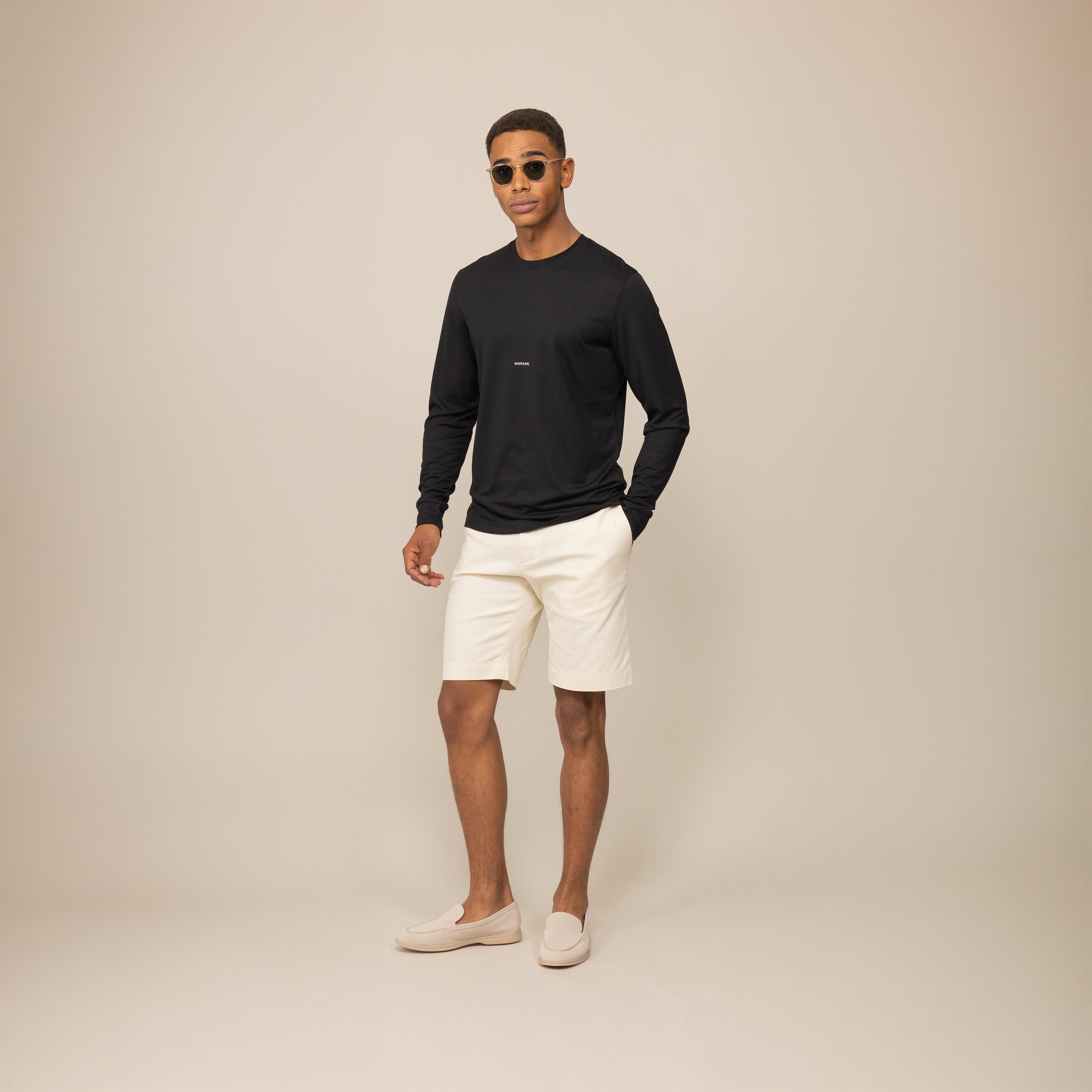 Man wearing a Marame Long Sleeve Logo T-Shirt in Black, front view.