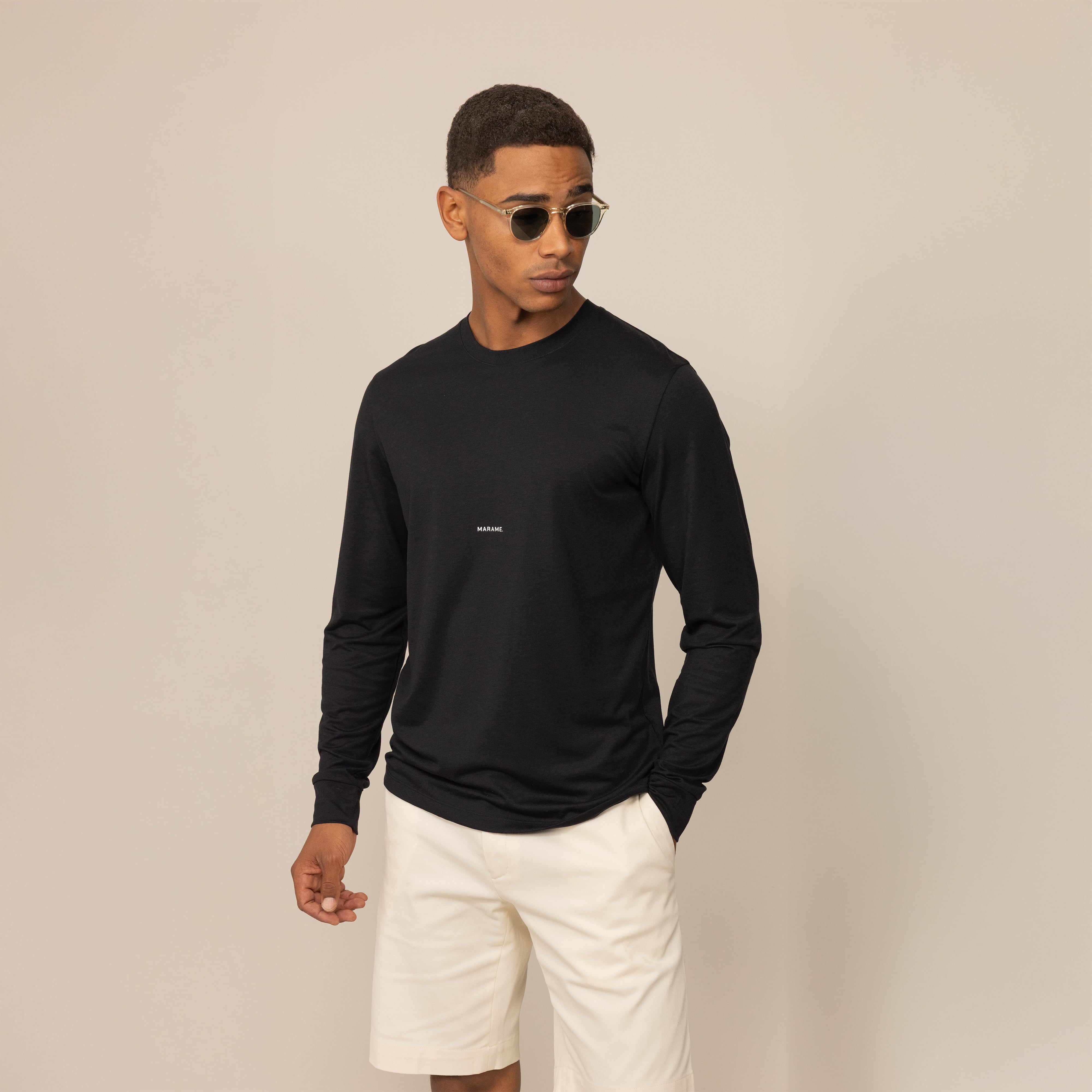 Man wearing a Marame Long Sleeve Logo T-Shirt in Black, front view.