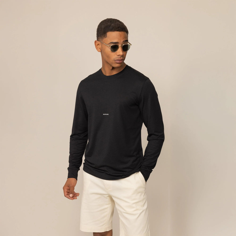 Man wearing a Marame Long Sleeve Logo T-Shirt in Black, front view. |black