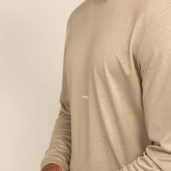 Man wearing a Long Sleeve Logo T-Shirt in Canyon Clay, closeup. |canyon clay