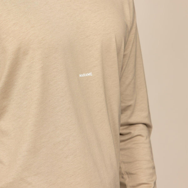 Man wearing a Marame Long Sleeve Logo T-Shirt in Canyon Clay, closeup. |canyon clay