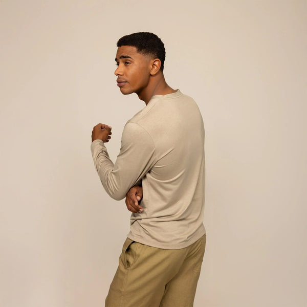 Man wearing a Marame Long Sleeve Logo T-Shirt in Canyon Clay, rear view.