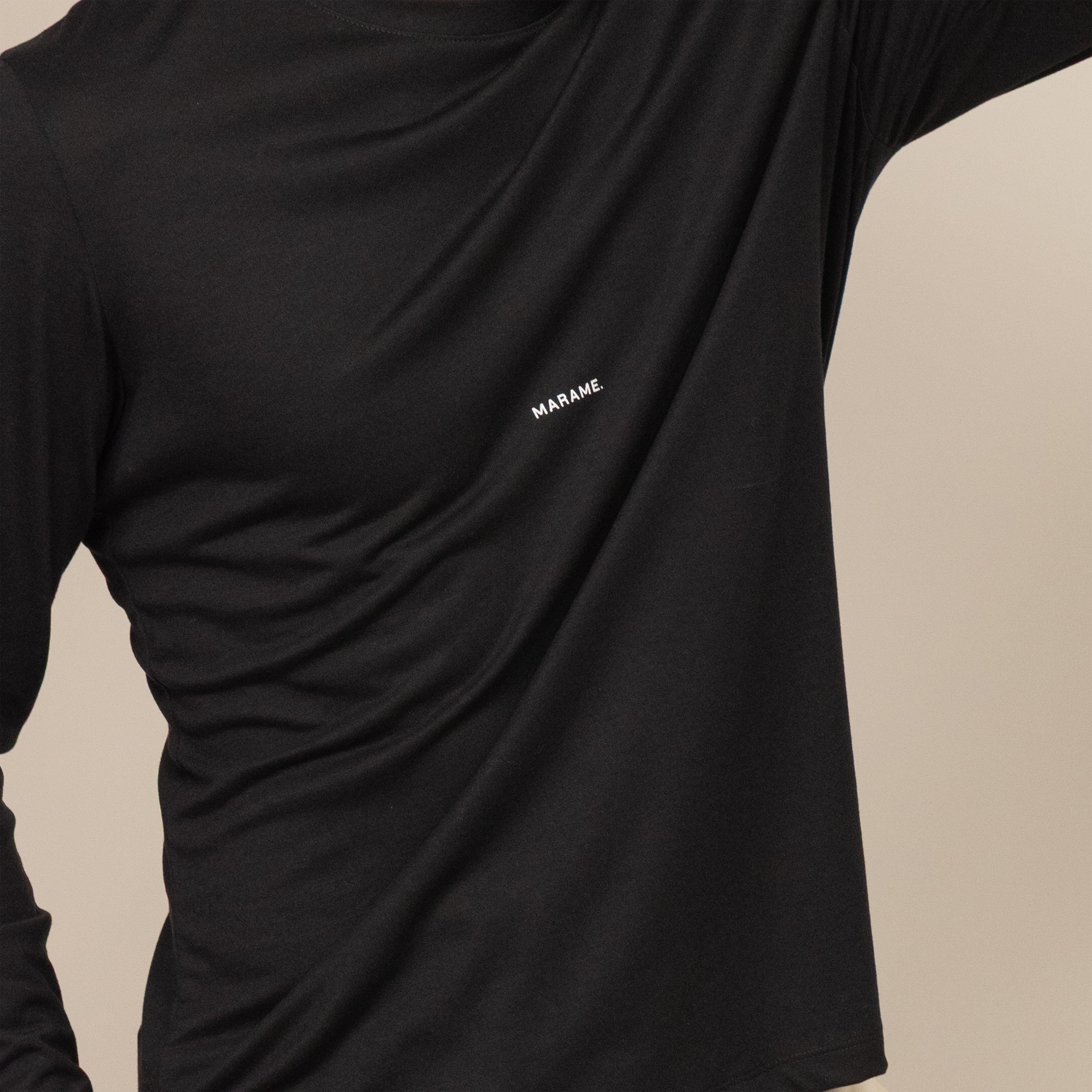 Man wearing a Long Sleeve Logo T-Shirt in Black, closeup.