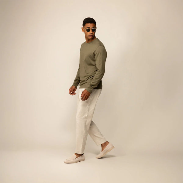 Man wearing a Marame Long Sleeve Logo T-Shirt in Olive, front view.