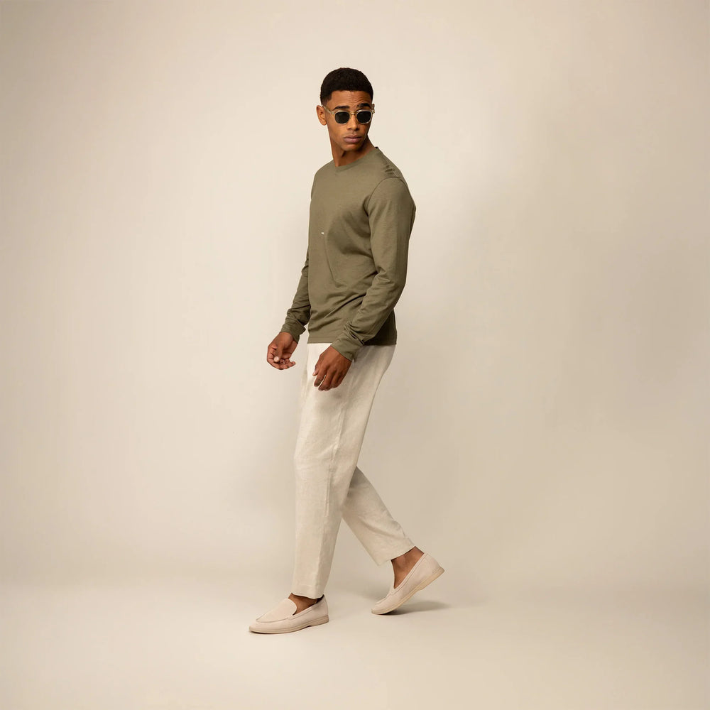 Man wearing a Marame Long Sleeve Logo T-Shirt in Olive, front view.