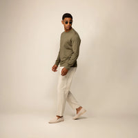 Man wearing a Marame Long Sleeve Logo T-Shirt in Olive, front view.