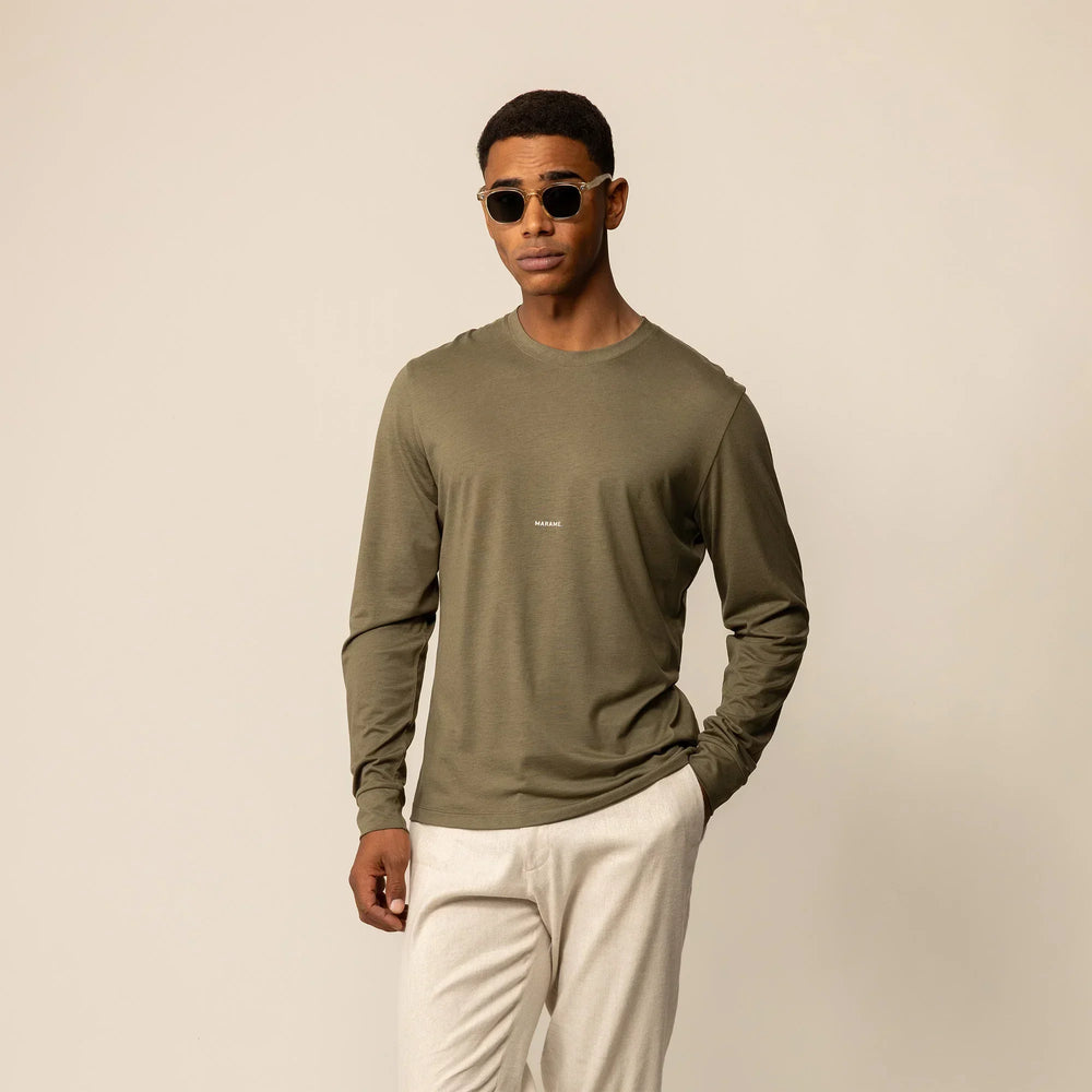 Man wearing a Marame Long Sleeve Logo T-Shirt in Olive, front view.