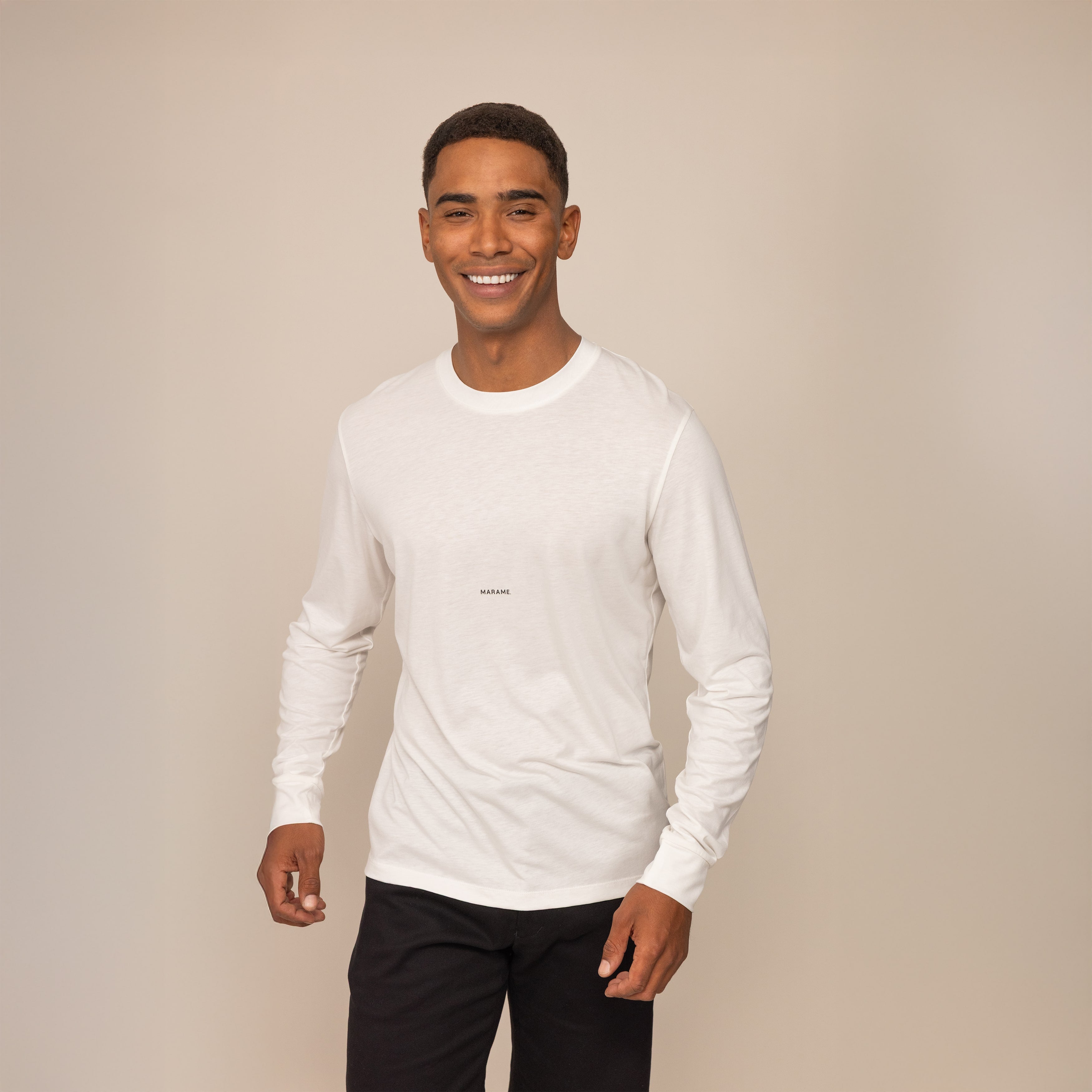 Man wearing a Marame Long Sleeve Logo T-Shirt in White, front view.