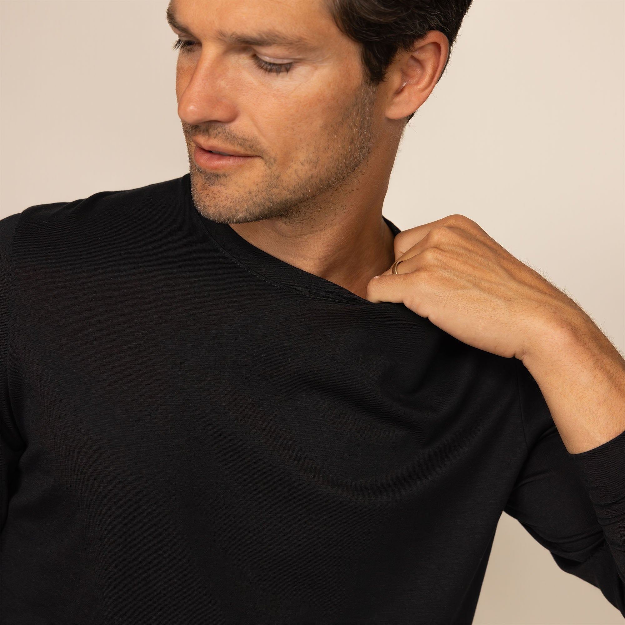 Man wearing a Long Sleeve Lyocell Blend T-Shirt in Black, closeup.