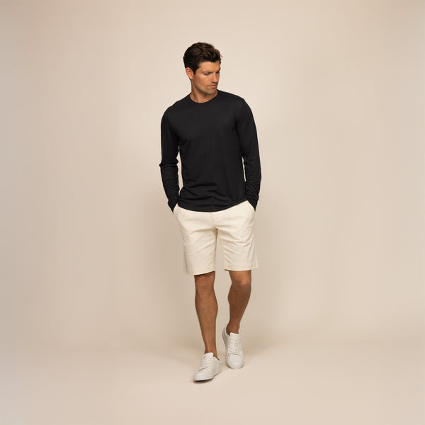 Man wearing a Marame Long Sleeve Lyocell Blend T-Shirt in Black, front view.