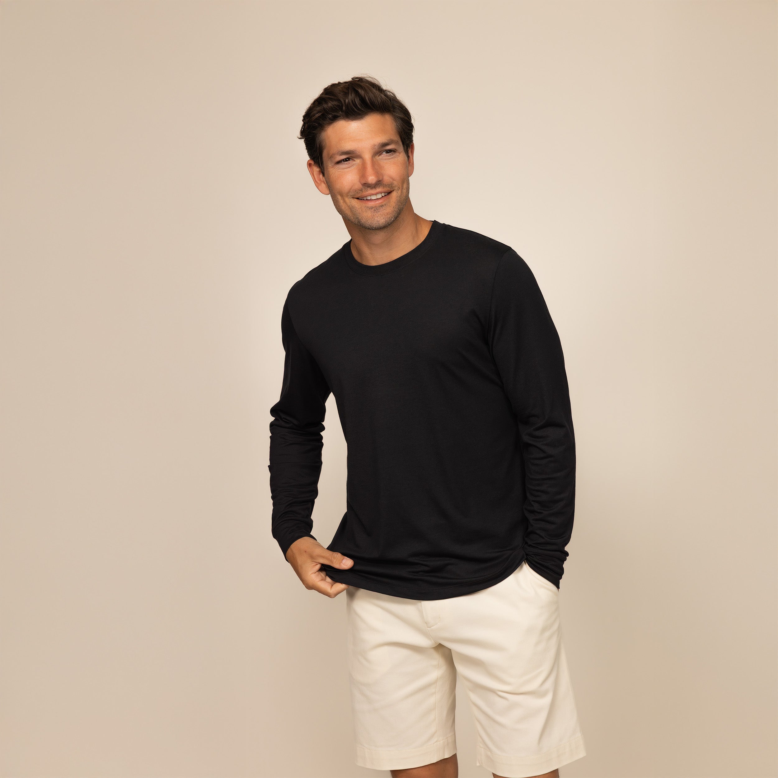 Man wearing a Marame Long Sleeve Lyocell Blend T-Shirt in Black, front view.