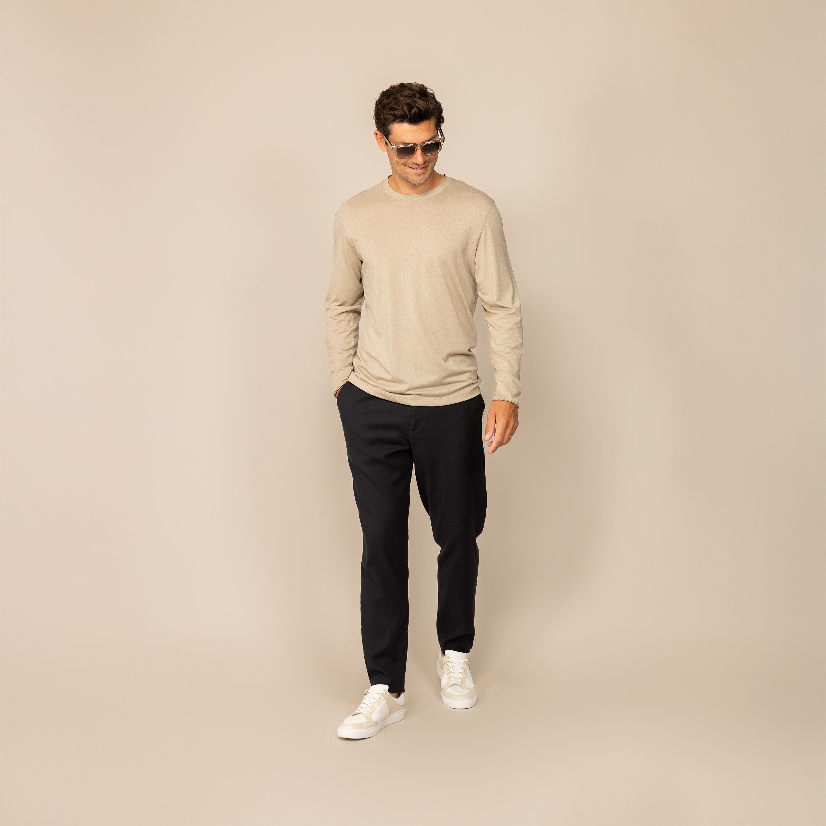 Man wearing a Marame Long Sleeve Lyocell Blend T-Shirt in Canyon Clay, front view.